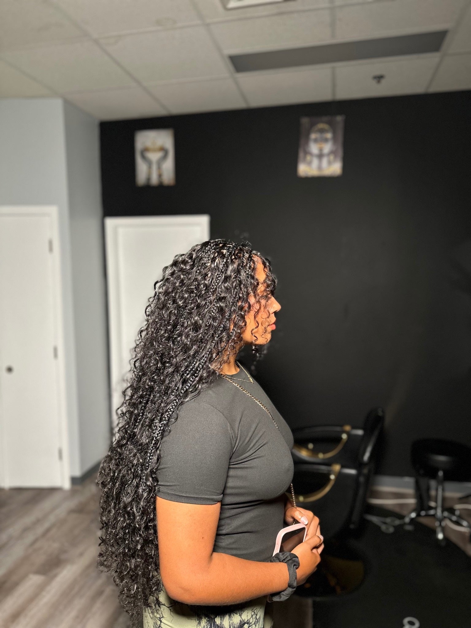 Side profile showing long jet-black HBTBEAUTY boho curls